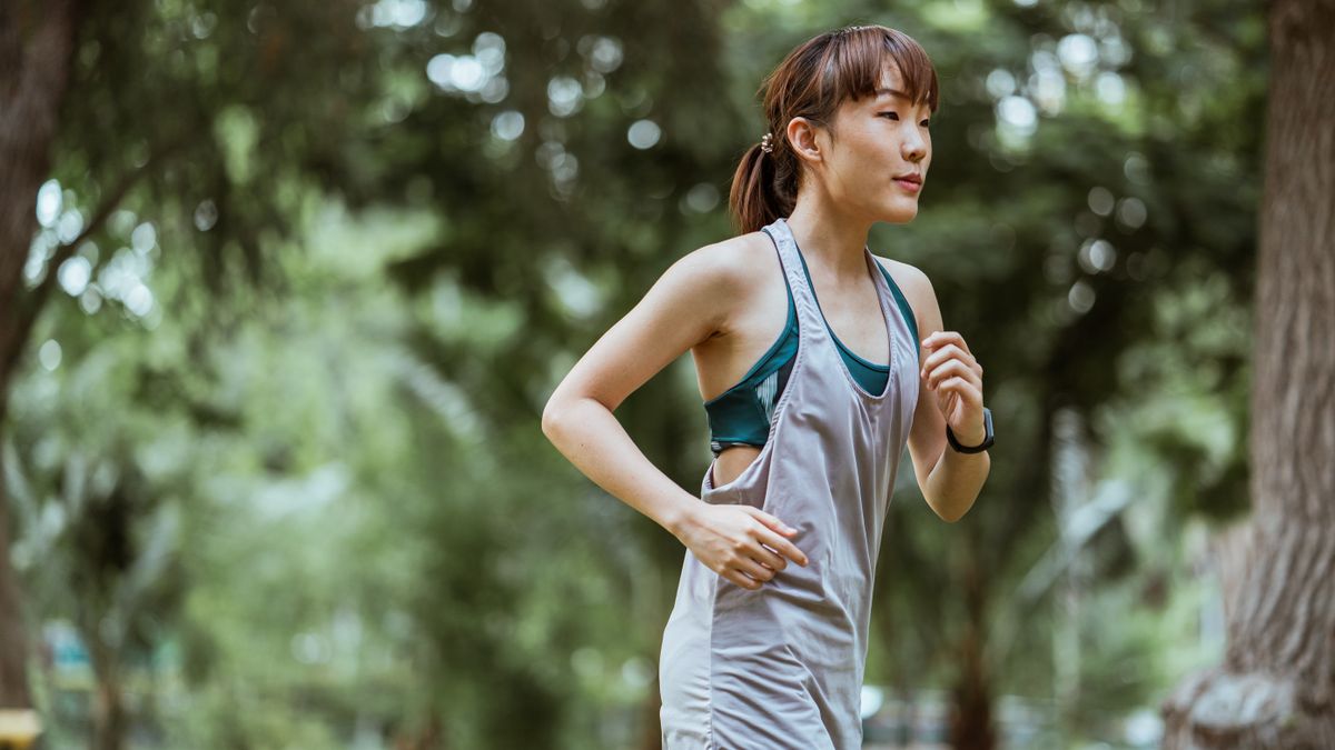 A calm runner jogging in nature — representing the recovery mindset and the importance of deload weeks in a training cycle
