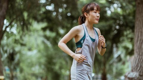 Calm runner jogging in nature — representing the recovery and deload mindset during a running training cycle
